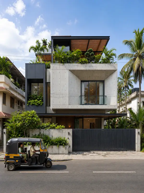 2-storey concrete residential house with rooftop terrace garden and pergola in Chennai by FIYO Studio